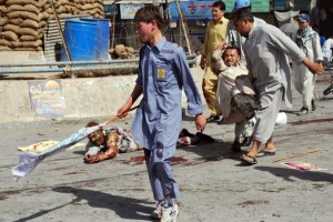 Pakistani Shiite Muslim men help injured